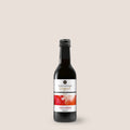 Württemberger Original Trollinger Rotwein von WZG in der Kleinflasche vor hellem Hintergrund.